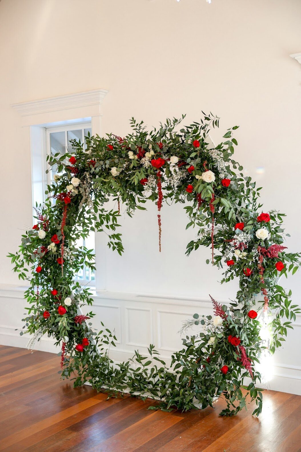 red rose accent ceremony arch