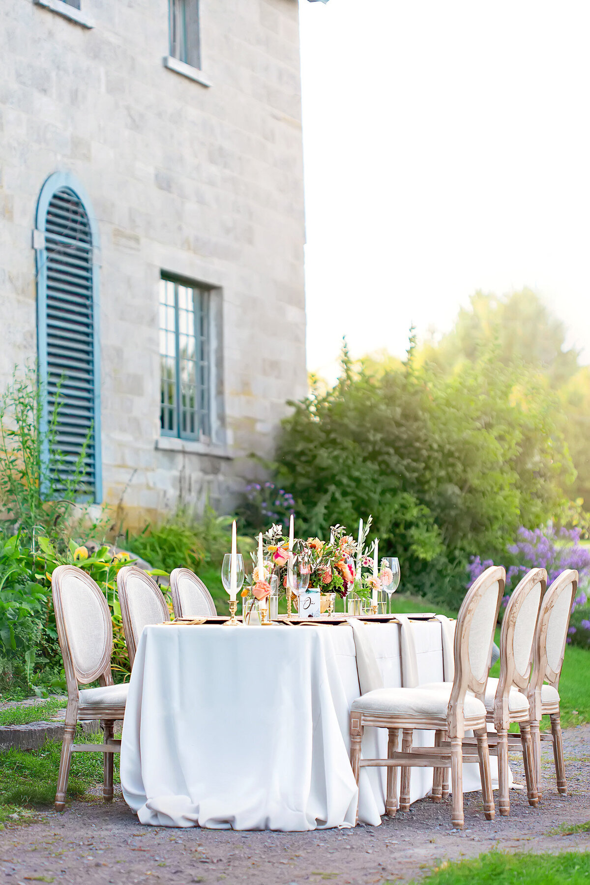 Luxury Tuscan villa decorated with plum, gold, orange, yellow, and baby blue accents for dream wedding ceremony