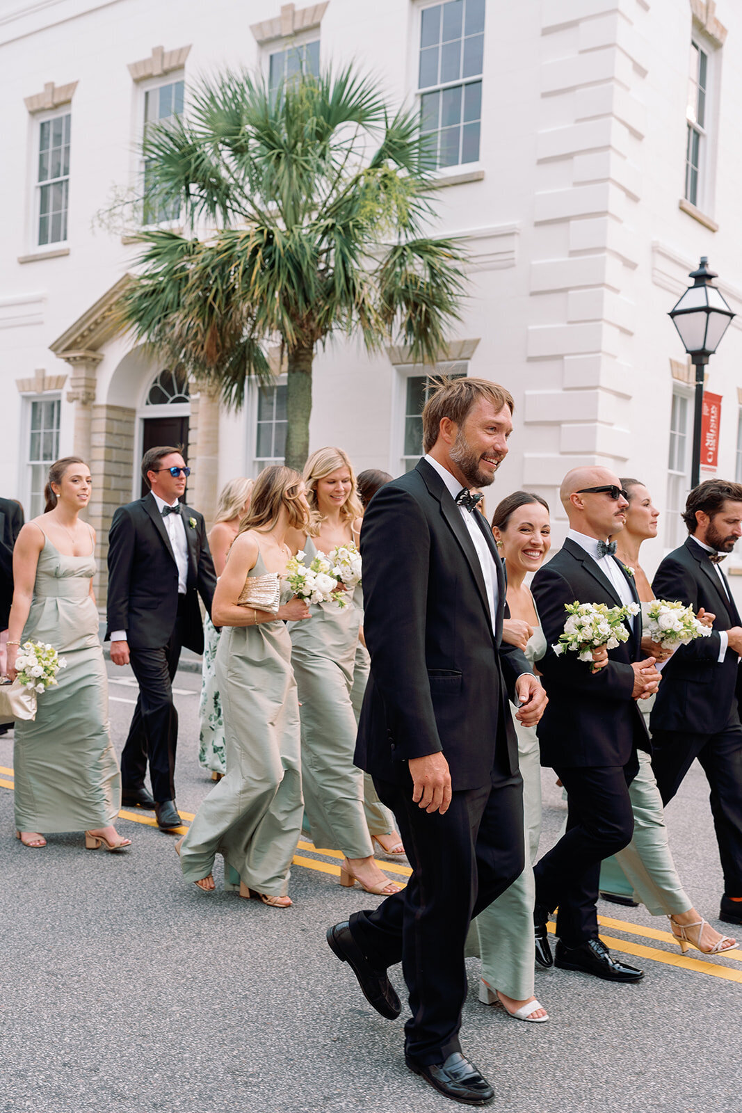 Classic Charleston Wedding processing down Meeting Street to Hibernian Hall by Sarah Bradshaw 0192