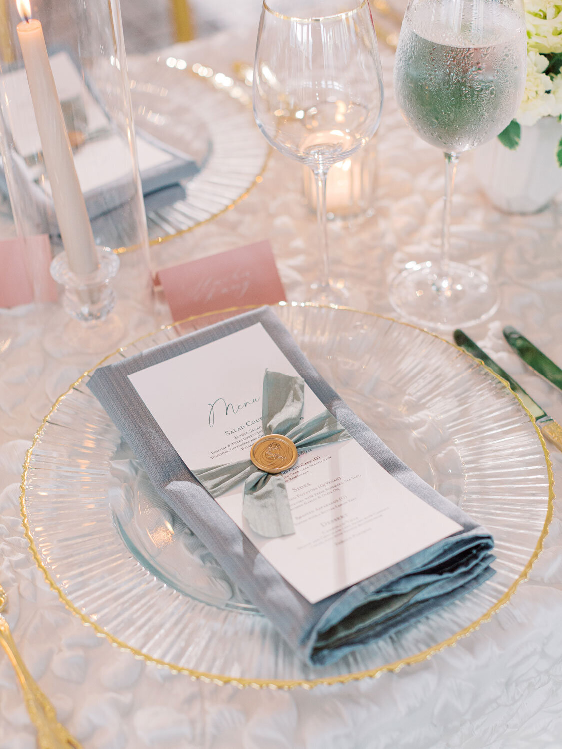 Close-up of menu with ribbon and wax seal