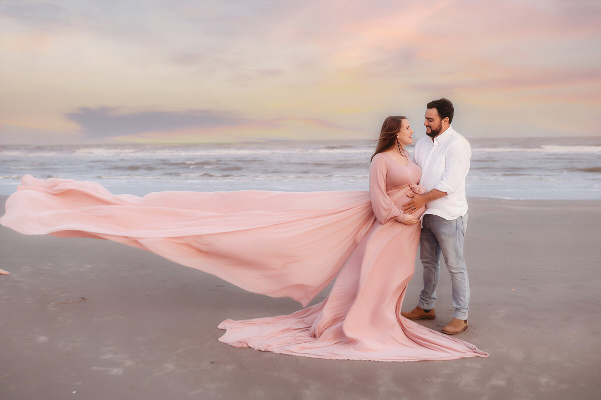 Expectant parents pose for Beach Maternity Photos during their Babymoon in Charleston, SC.