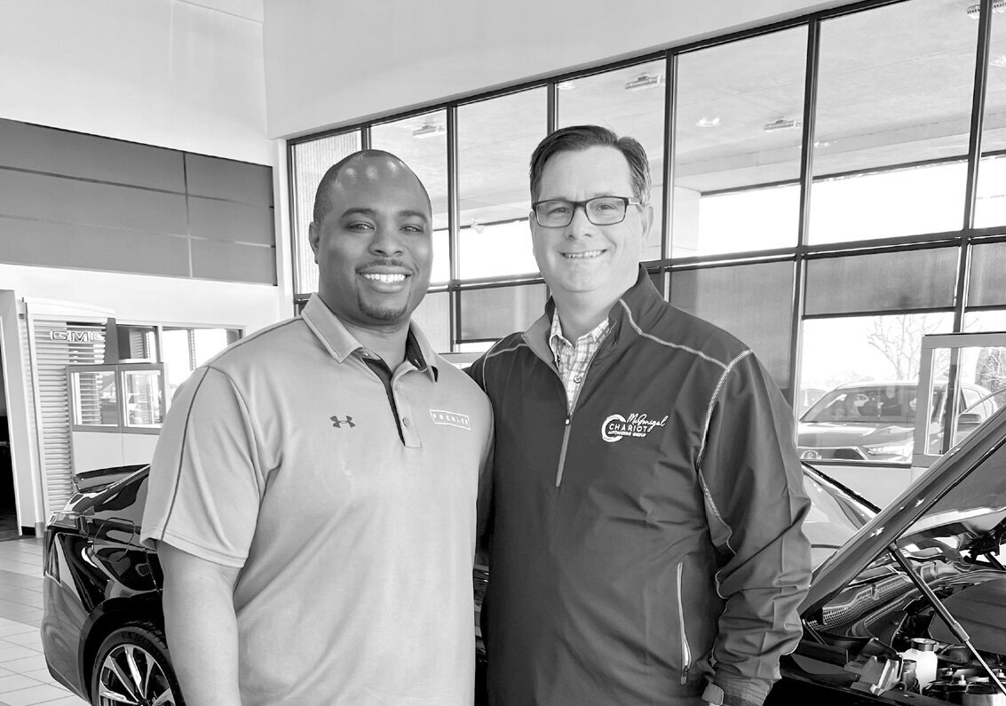 Donte Wilburn and man smiling for photo together