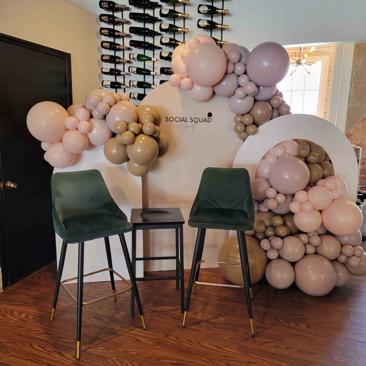 The event with air with flair decor's custom balloon installation, featuring the elegance of brown and pink fancy vibes.