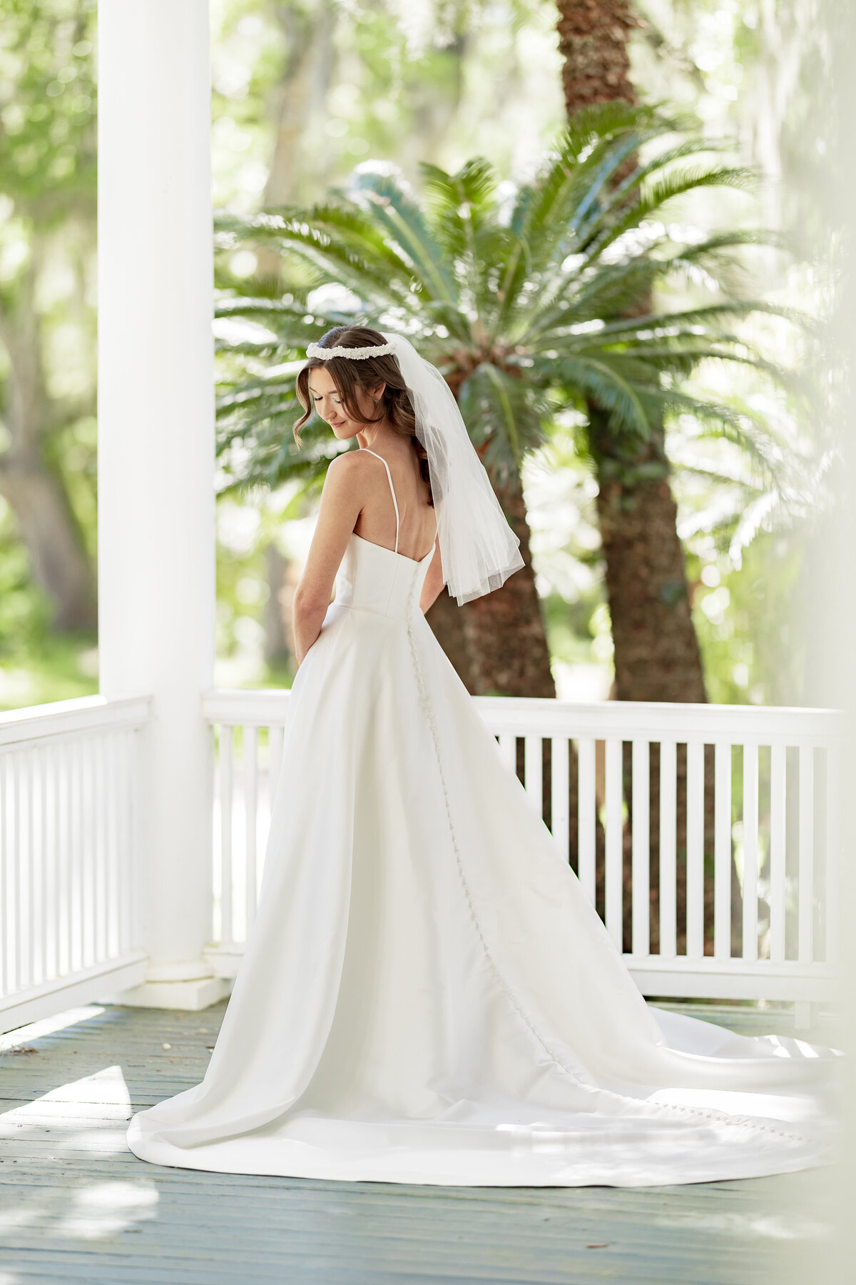 Tallahassee bride standing in her wedding dress.