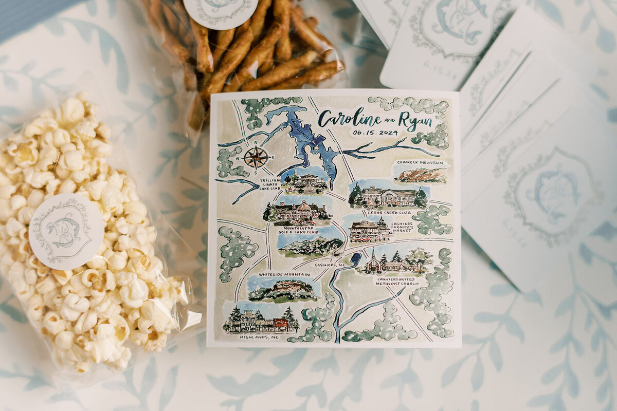 Custom watercolor welcome map and guest favors for destination mountain wedding weekend in Cashiers, North Carolina.