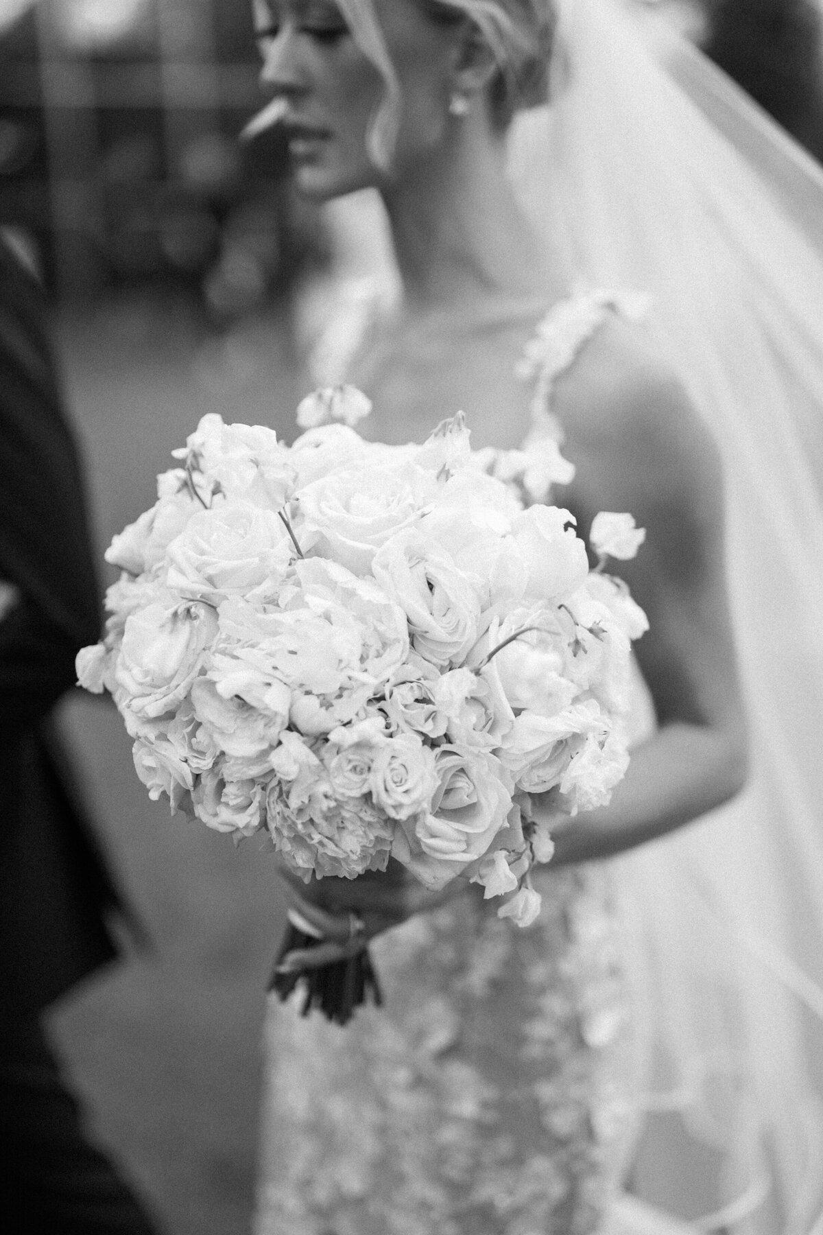 All white bridal bouquet with roses and peonies
