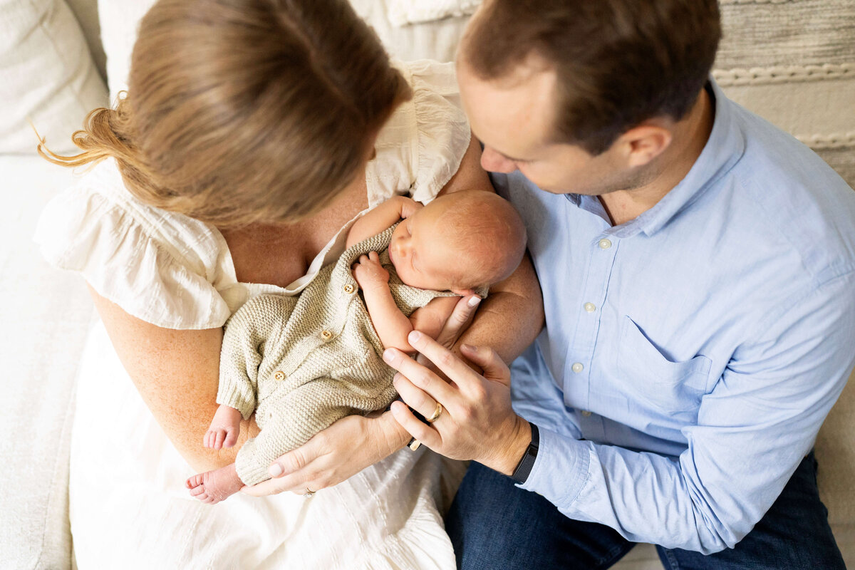 Parents holding newborn baby