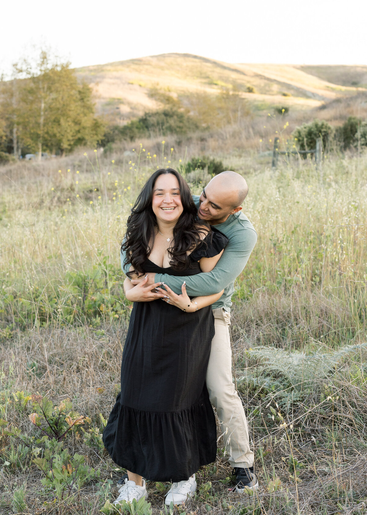 candid and fun couple photo in flower field
