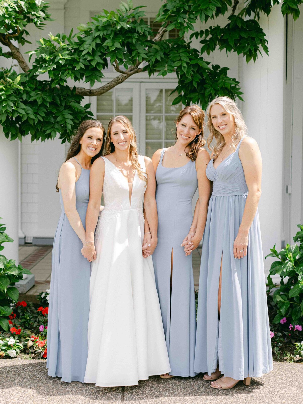 bridesmaids in light blue gowns