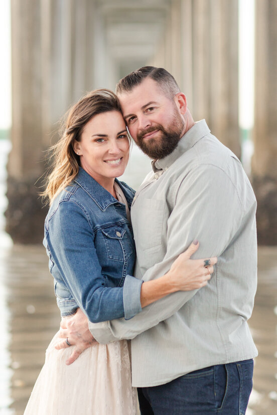 couple-hugging-under-Scripps-Pier-San-Diego