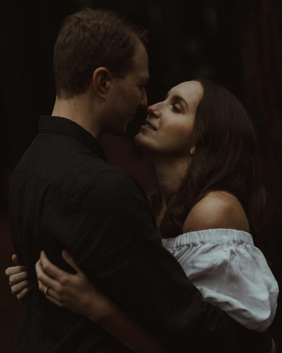 Cinematic storytelling wedding photography in Melbourne captures couple gazing into each other's eyes during pre-wedding photoshoot.