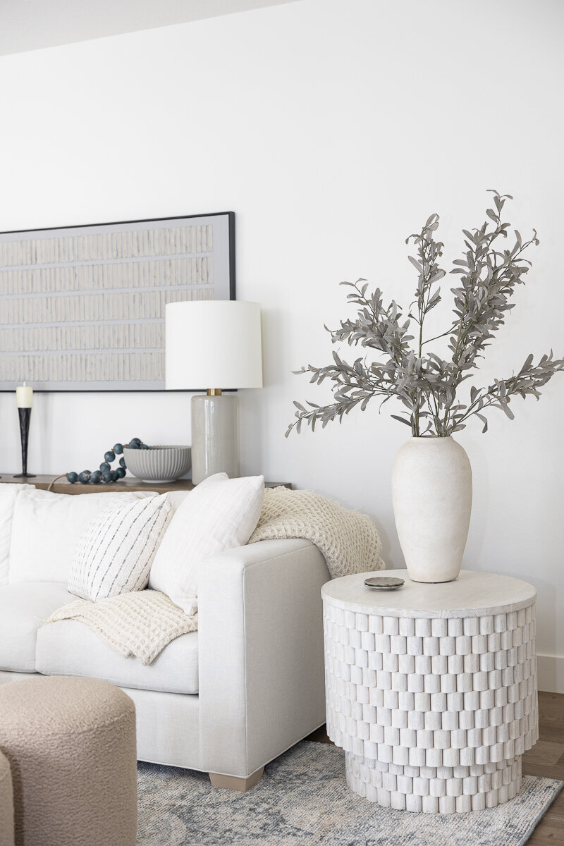 dewine design orlando interior designer belle isle living room with white sofa and round side table