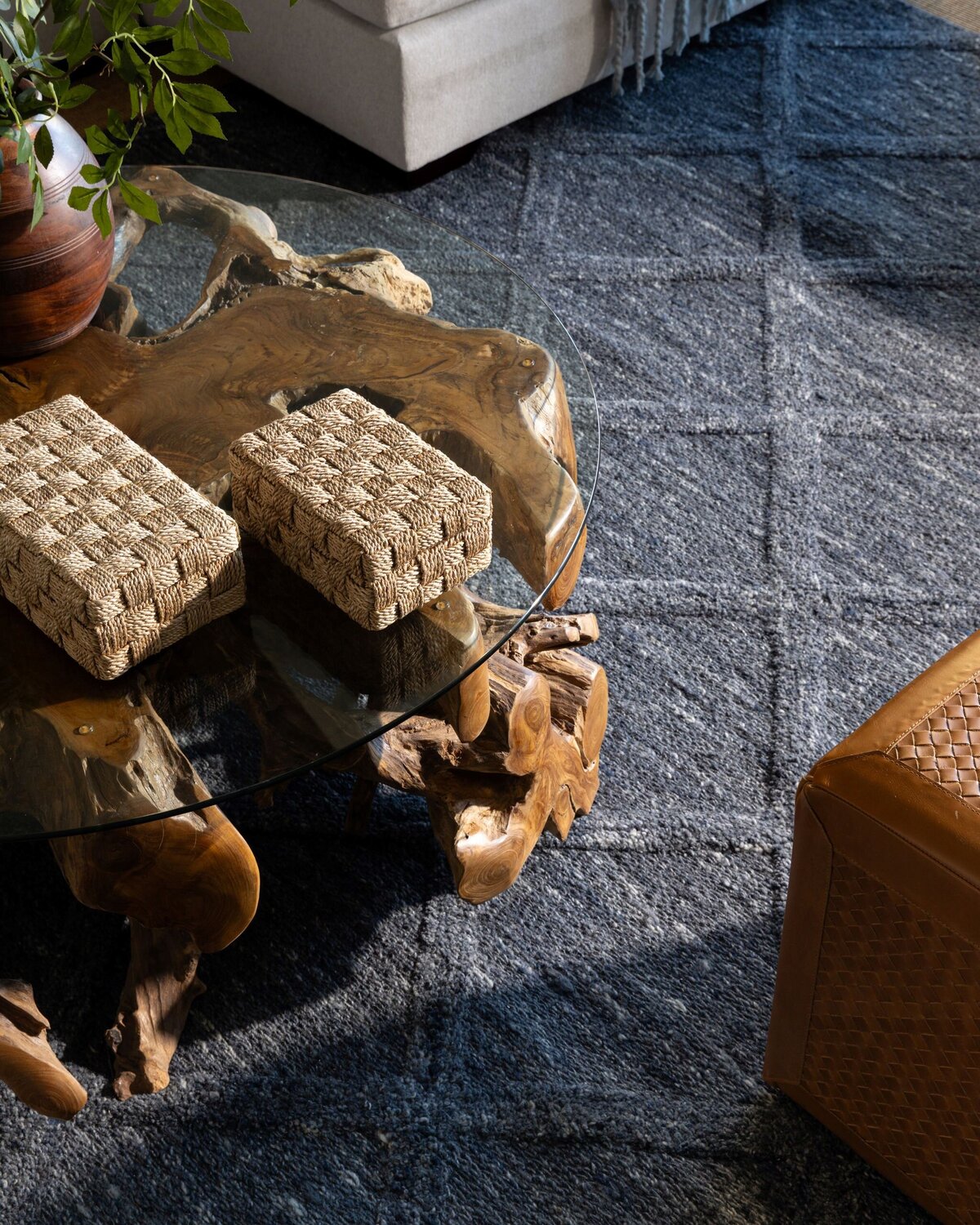 navy rug and interesting wood coffee table