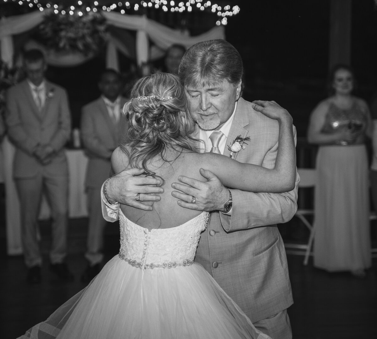 The bride, Amber, and her father share an emotional dance at Amber and Beau's wedding at Cheers Chalet in Lancaster, Ohio.