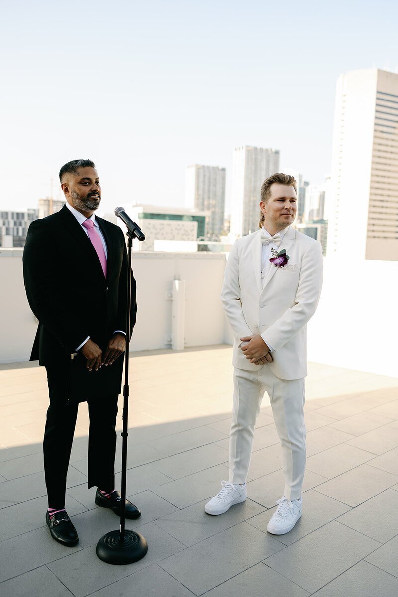 groom watching bride during ceremony at penthouse at riverside wharf wedding