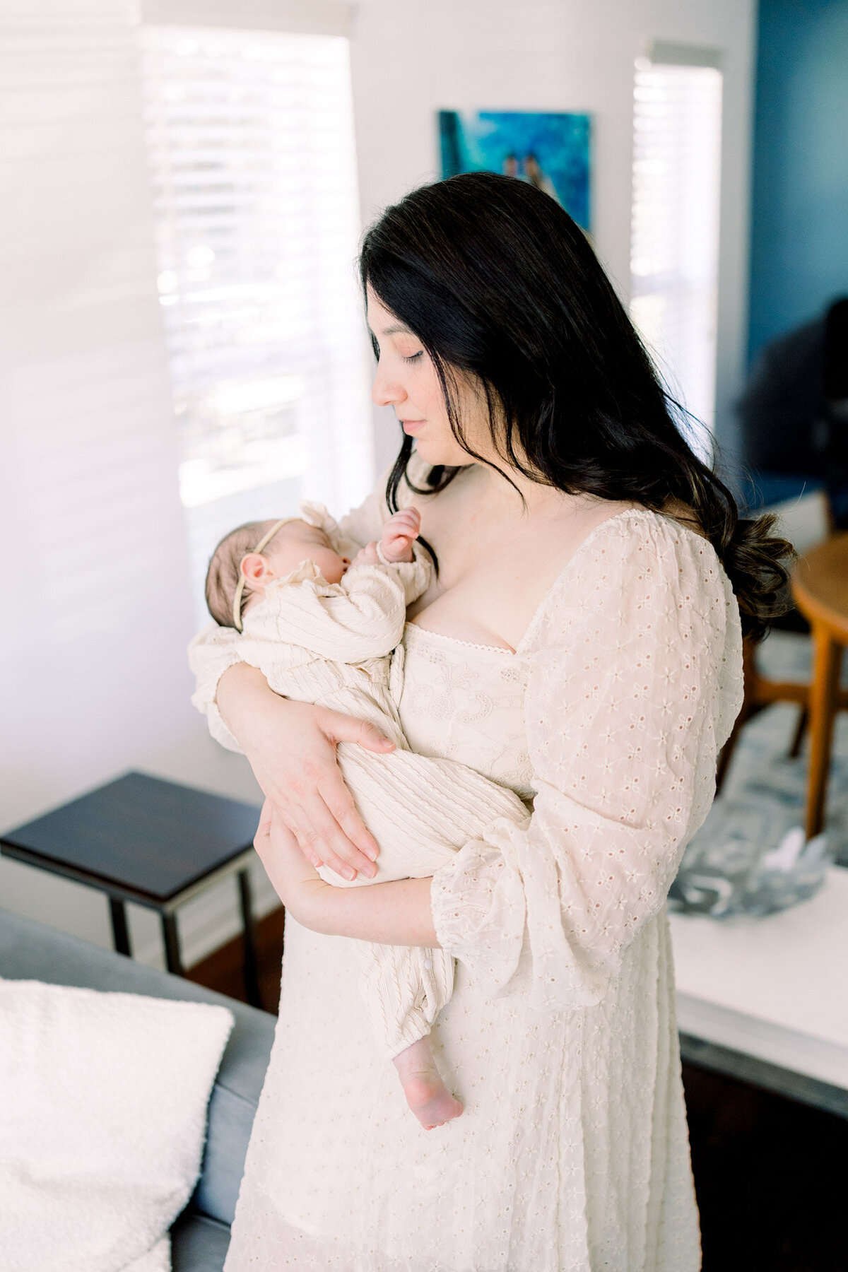mom looking at baby for Tampa newborn photographer Tina Marie Studio.