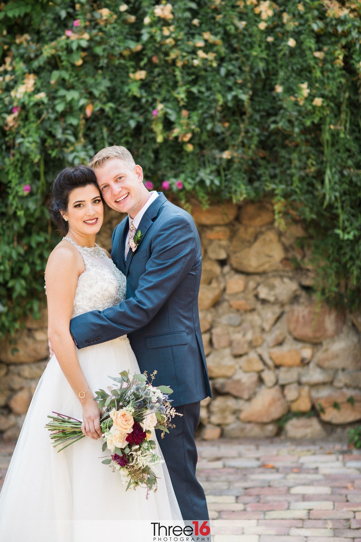 Bride and Groom pose for the wedding photographer