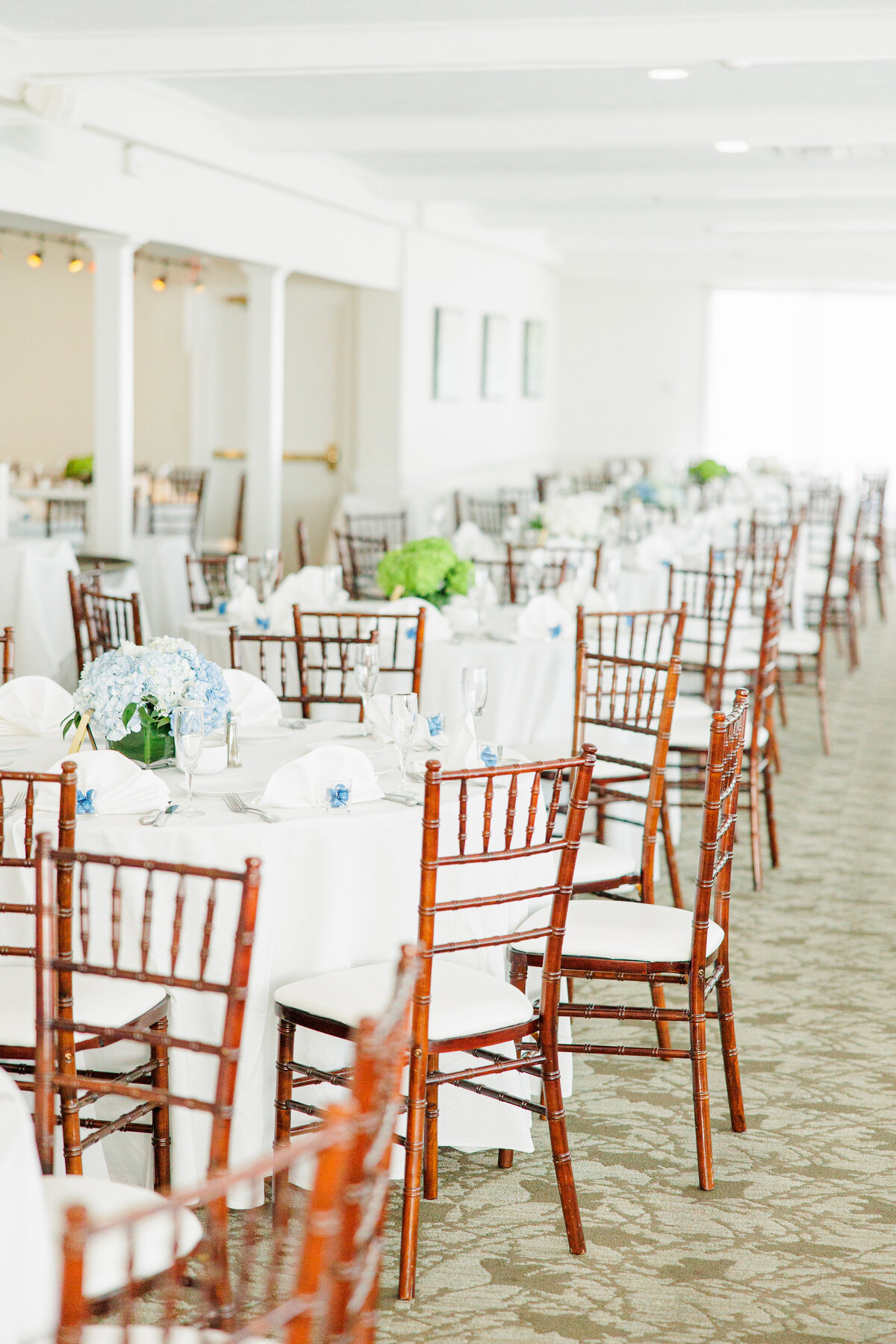 Wedding reception tables with hydrangeas at South Shore Country Club