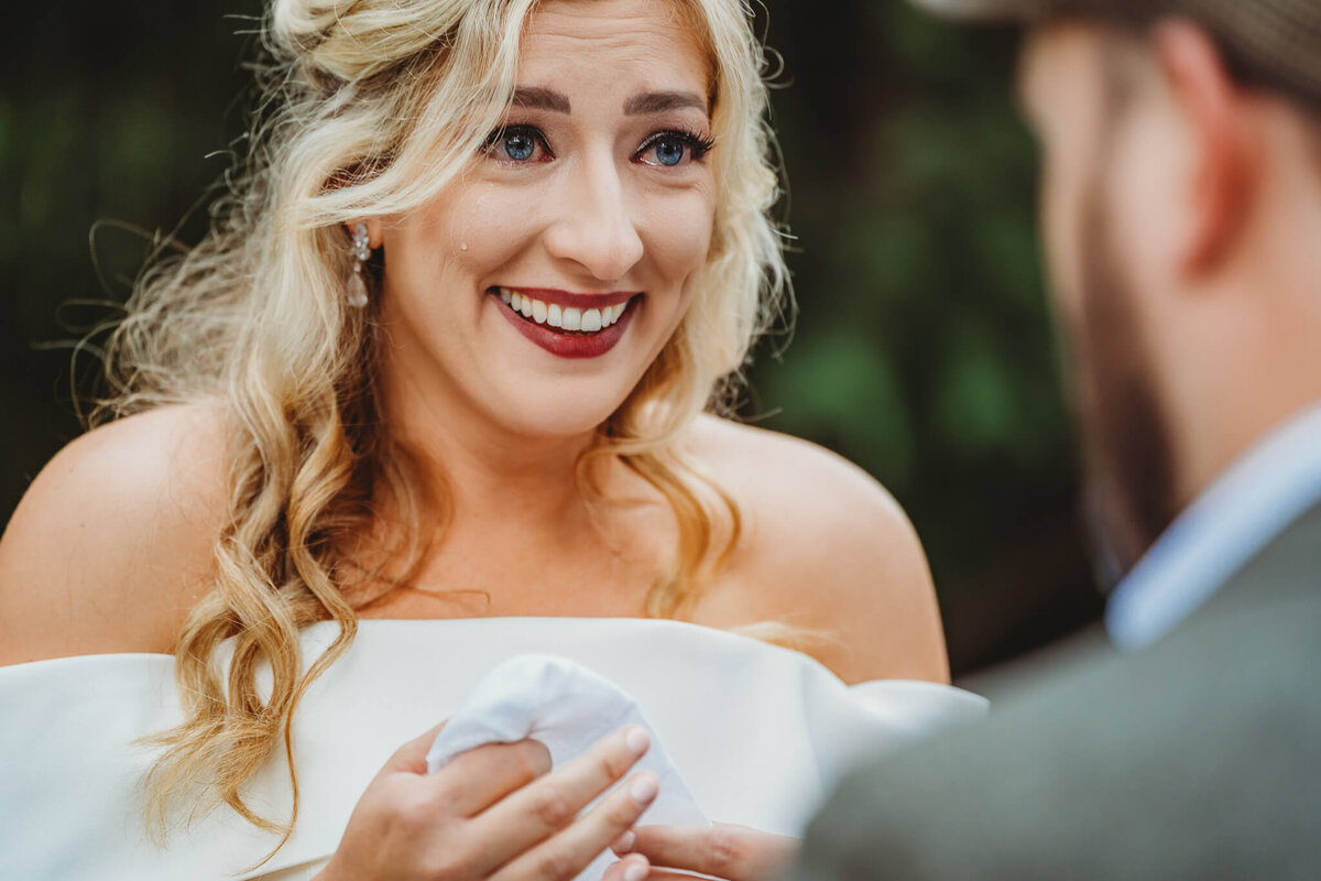 bride crying during ceremony in Rochester, MN