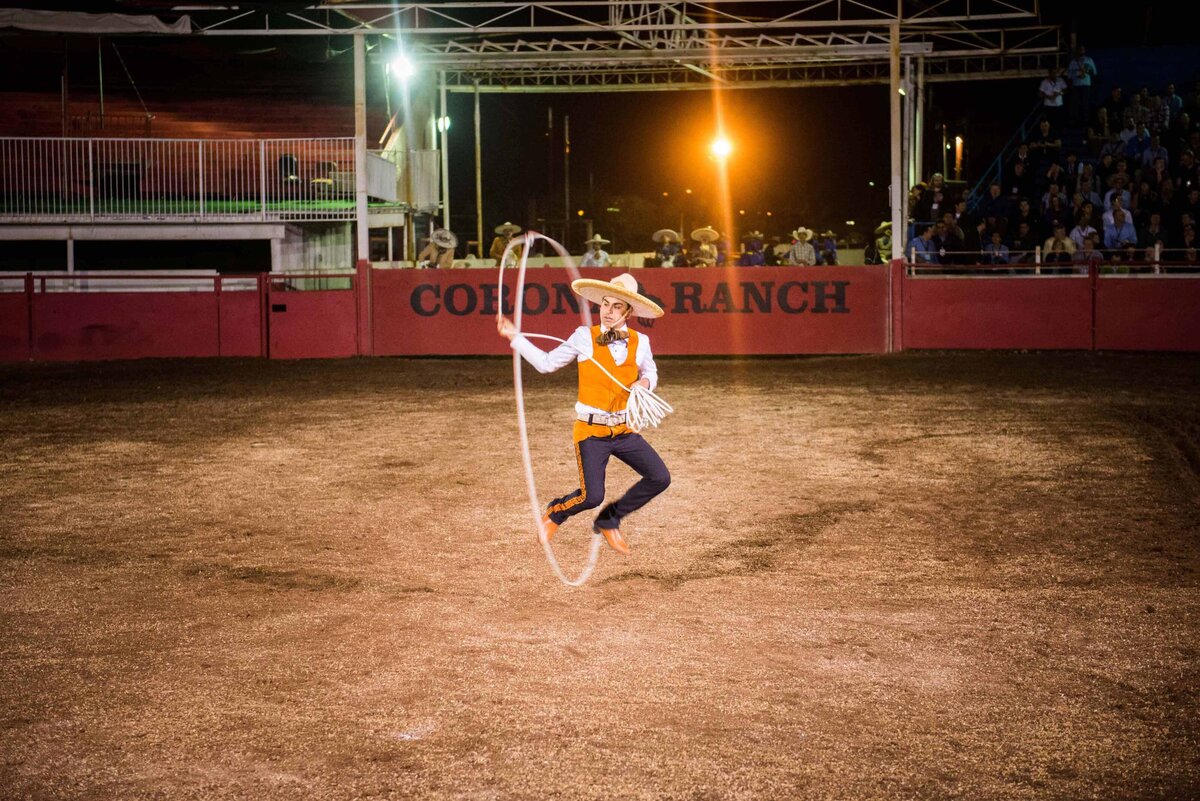 A cowboy jumps through lasso at Rodeo in San Antonio