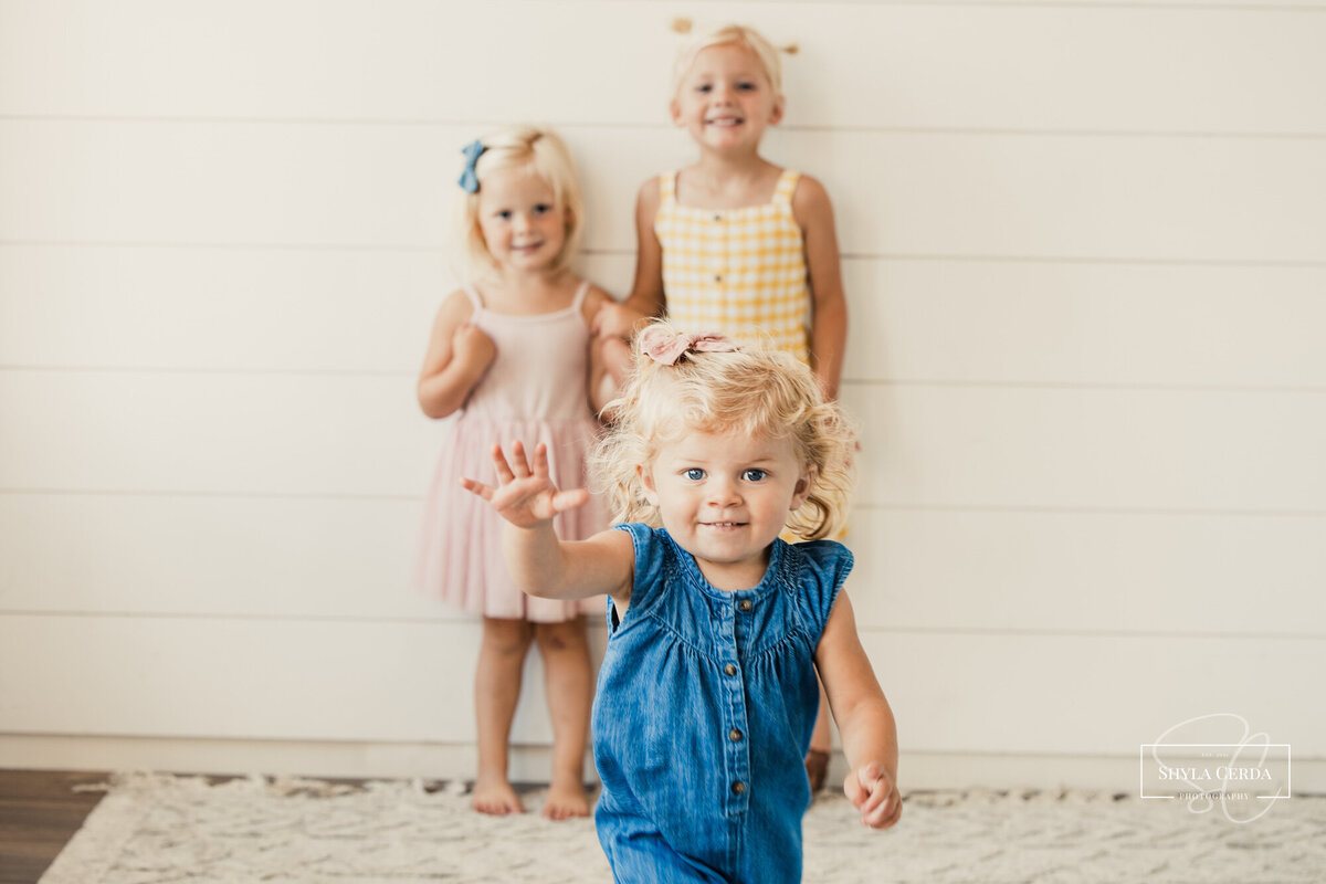 Baby girl running towards camera