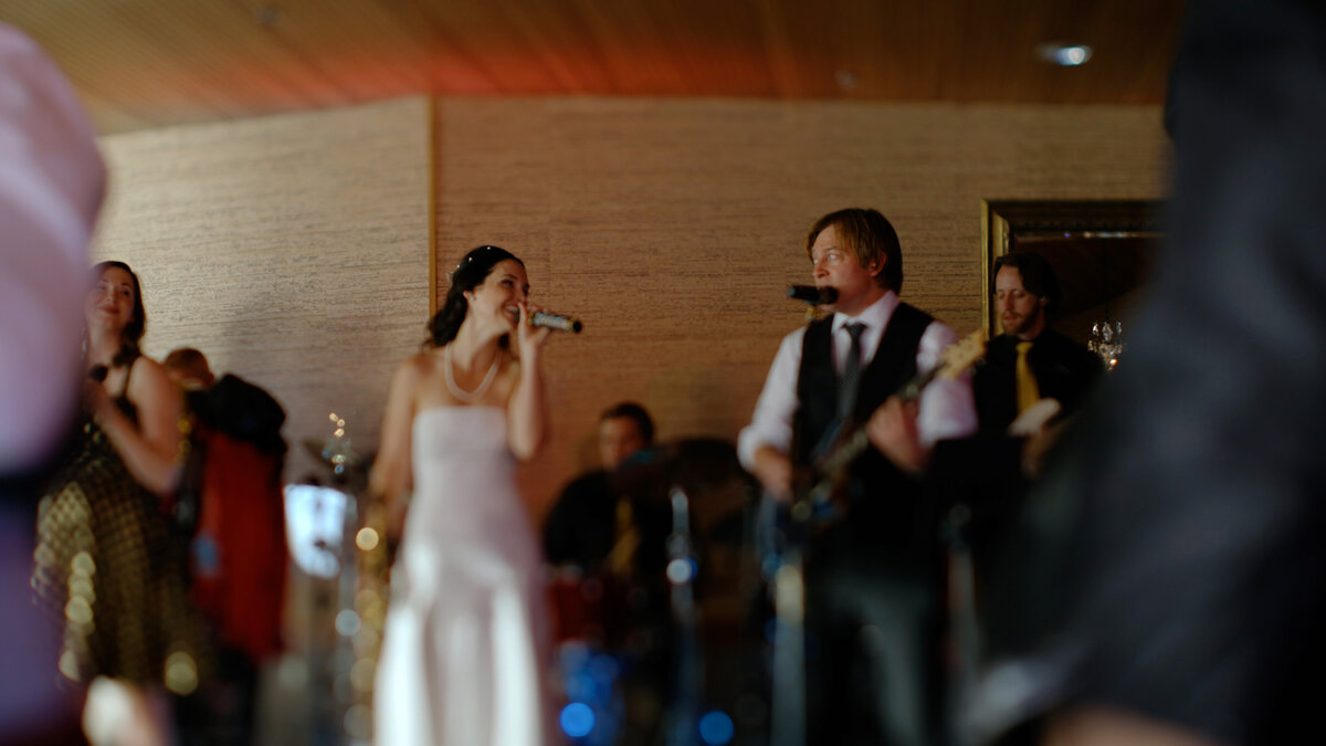 Edgewater Hotel; Seattle, Washington Wedding.  Groom and Bride sing in their Afterpary Band at their own wedding!