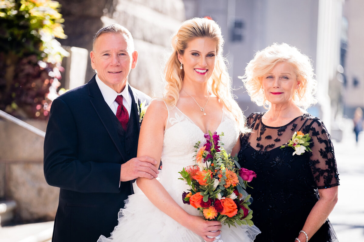 family picture outside of the allegheny county courthouse in pittsburgh