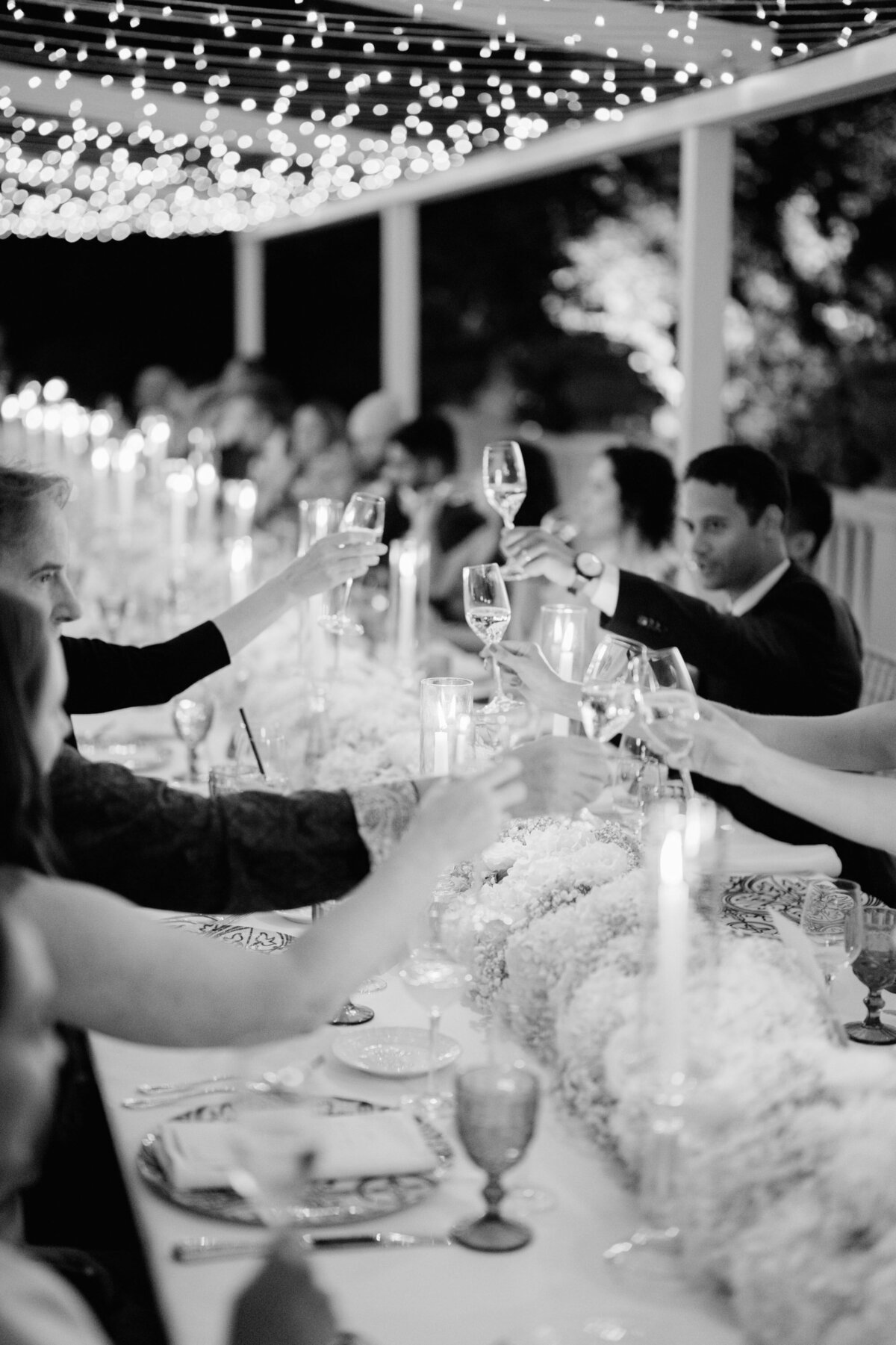 wedding guests toasting during the reception dinner