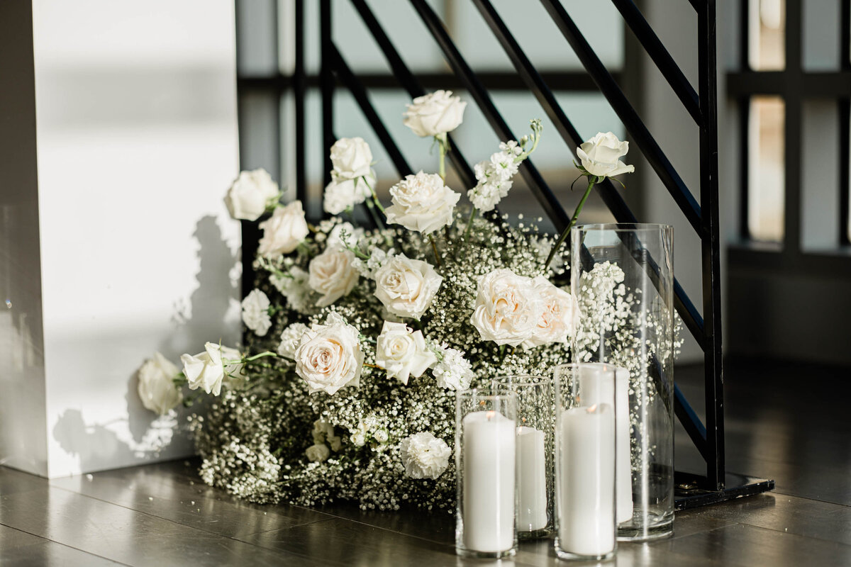 flowers at base of pillar and candles