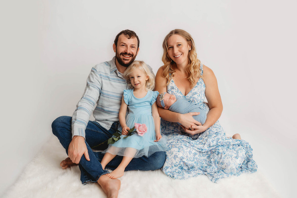 Charleston, SC #1 Newborn Photographer poses infant for Newborn Photoshoot in Charleston Portrait Studio.