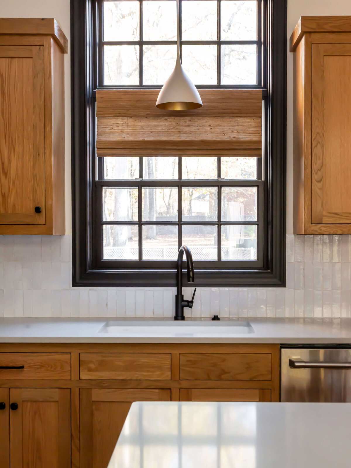 sweet southern home brighton place black sink and window frame in wooden kitchen