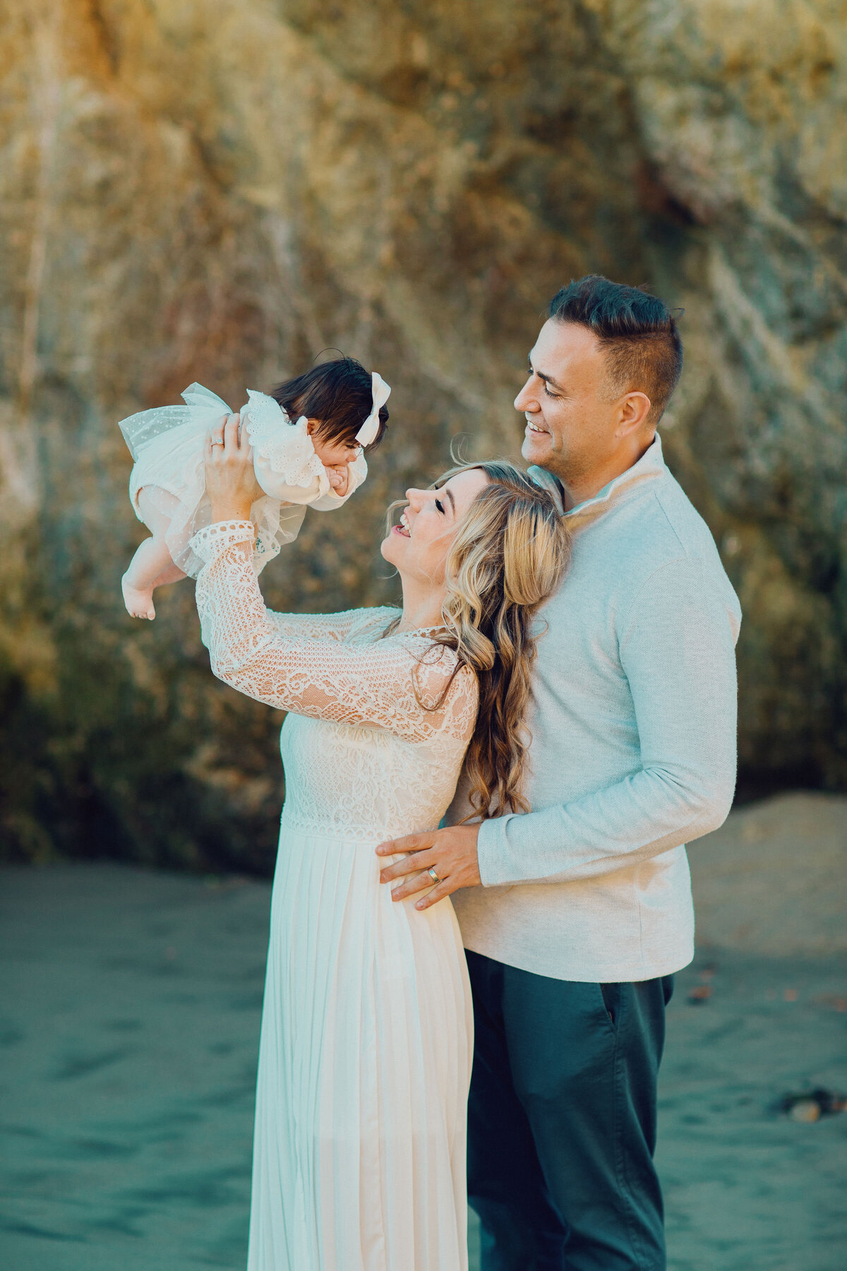 Family Portrait Photo Of Wife Carrying The Baby Beside Her Husband Los Angeles