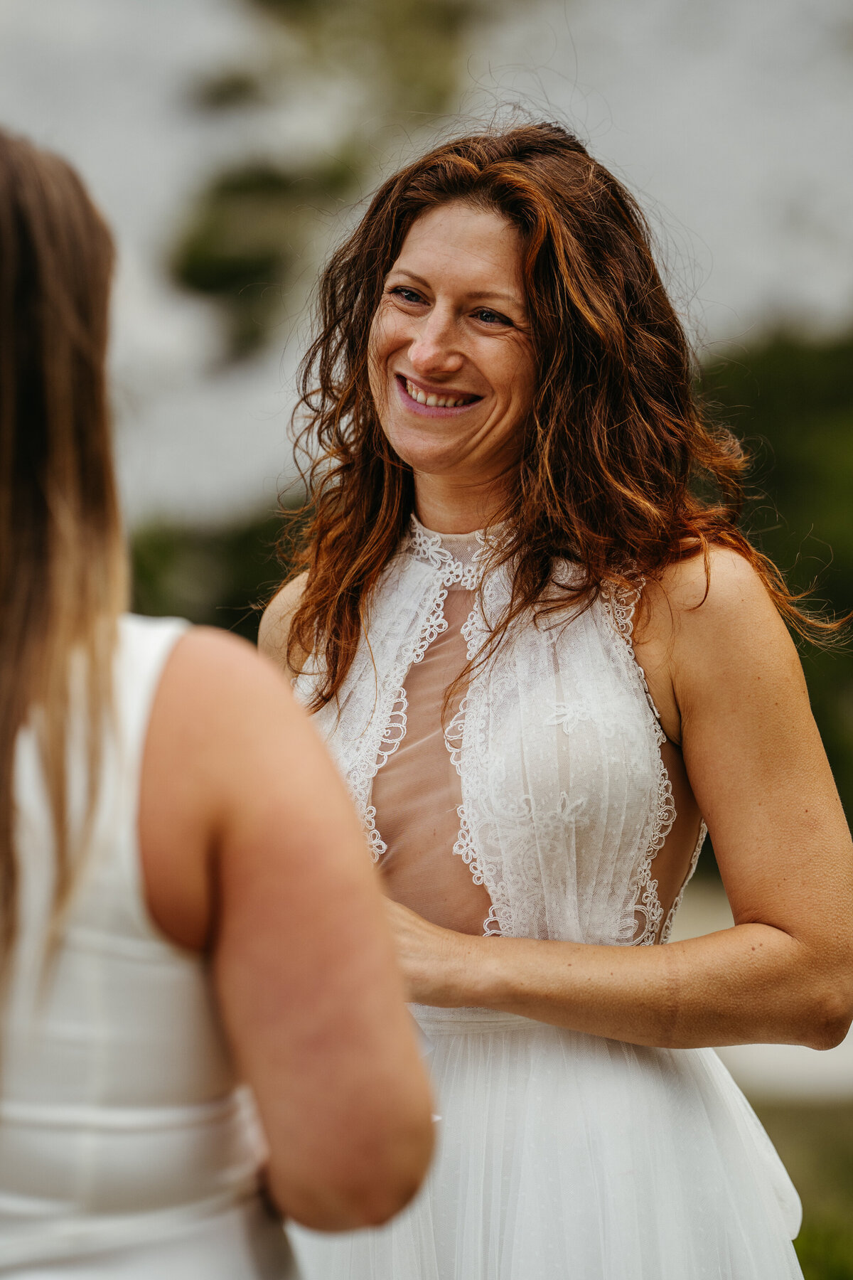 Emotional bride wiping tears during vows
