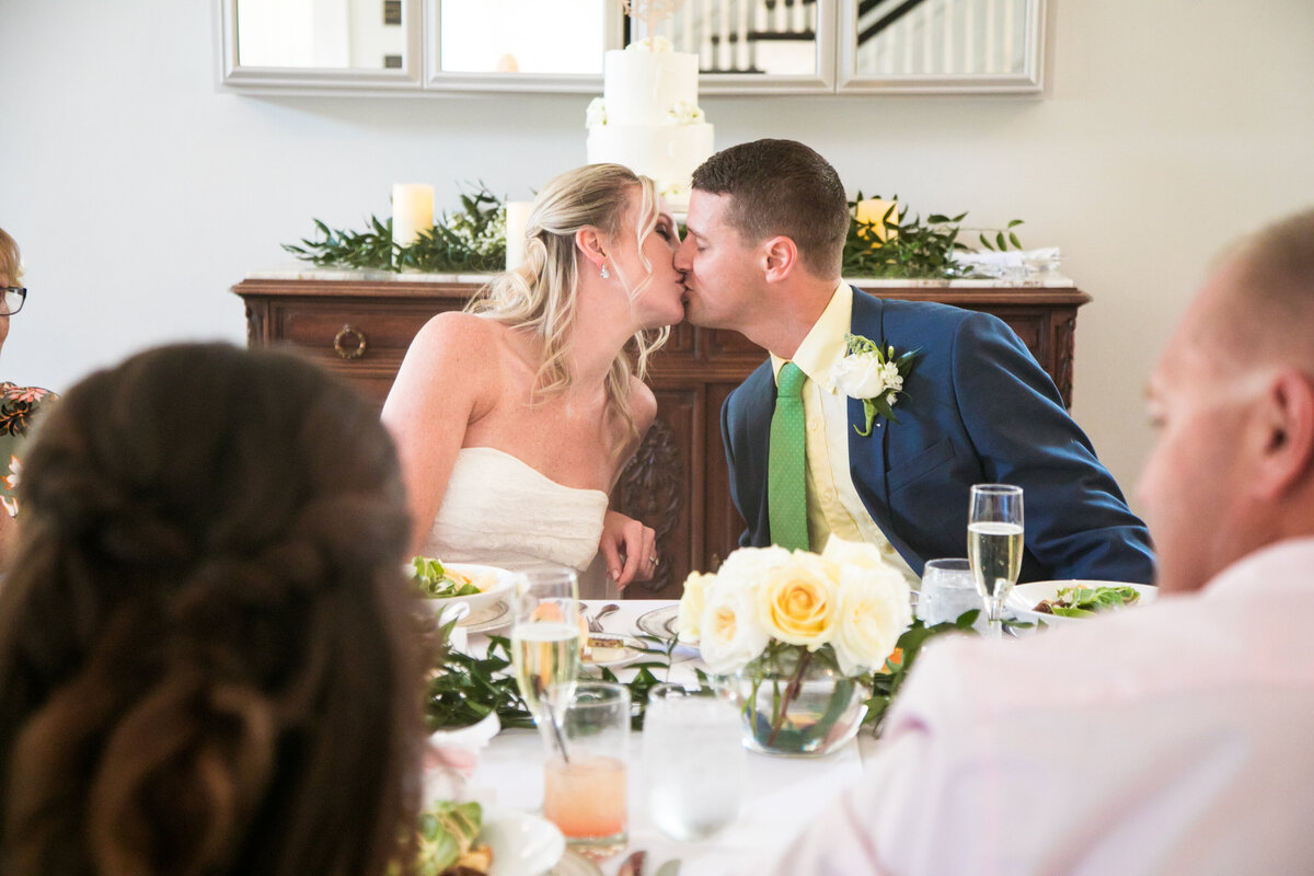 bride and groom kissing at reception at the Capen House in Winter Park