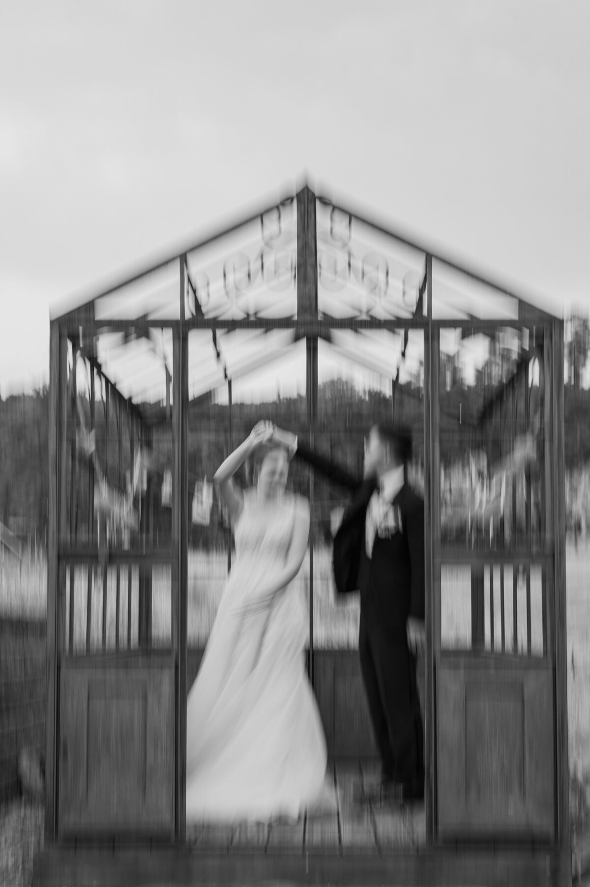 A couple dancing in a small covered awning
