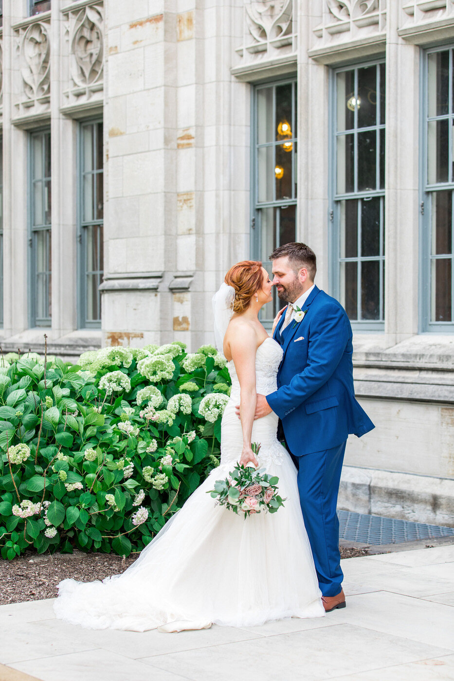 Wedding Couple Embracing in Front of Pittsburgh Cathedral of Learning