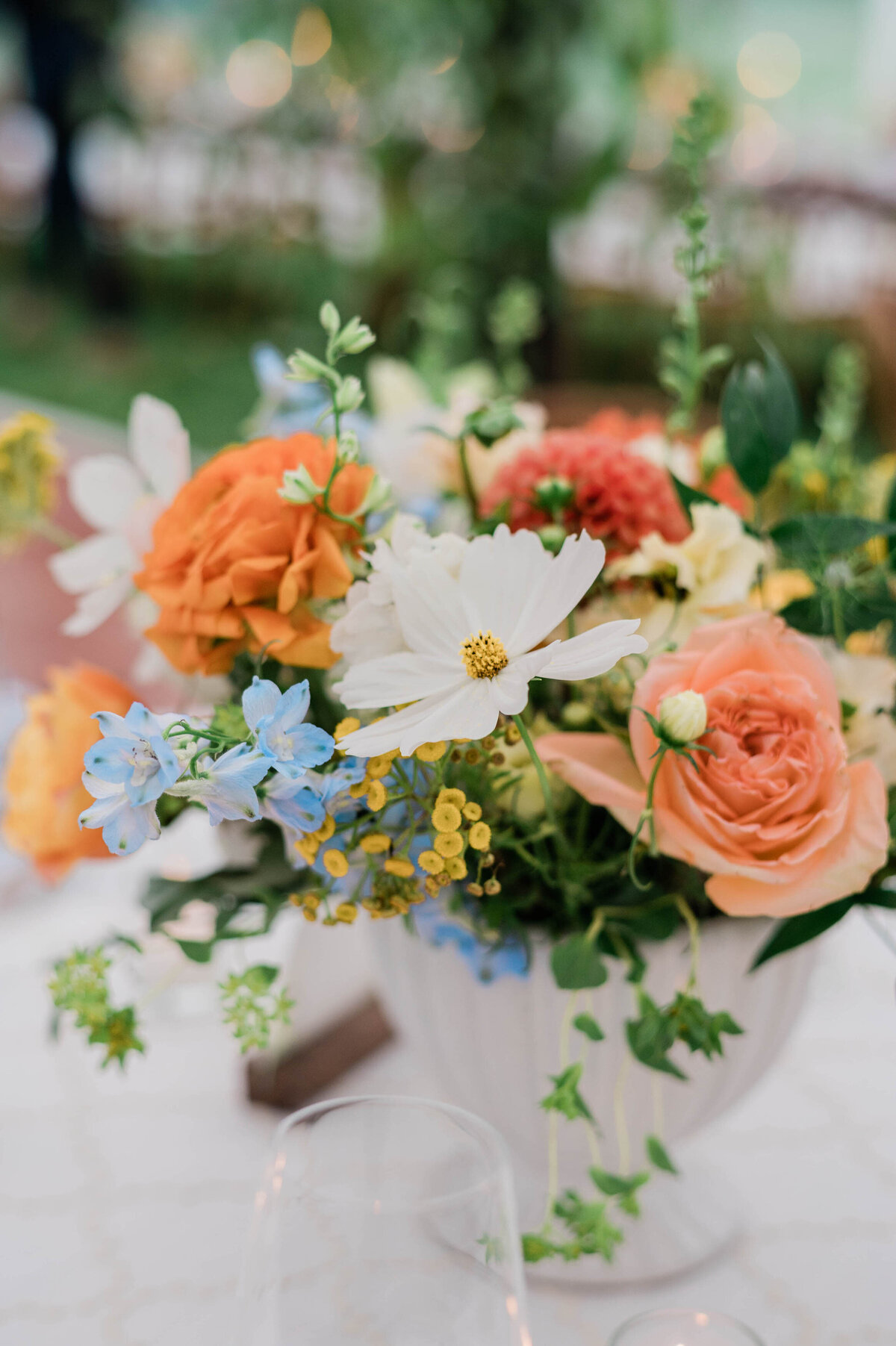Orange and white table floral arrangements