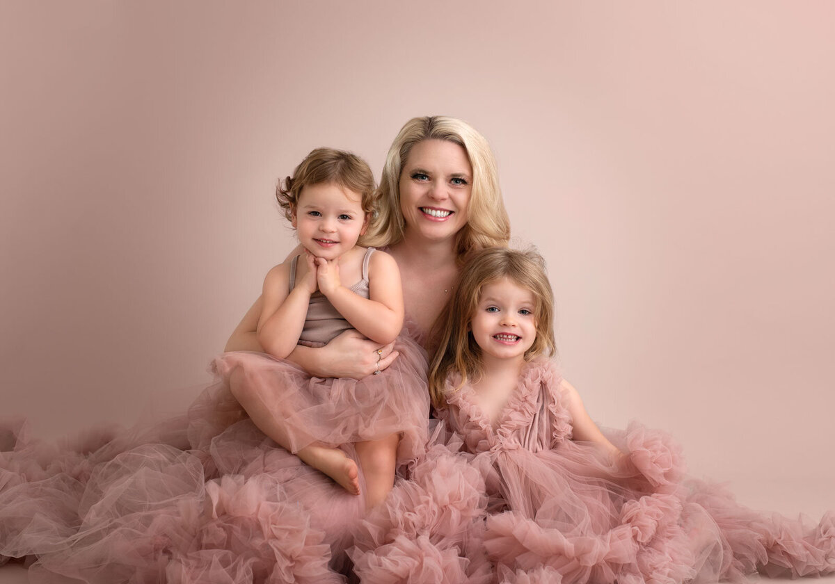 mom and daughters at saint louis family photography session in couture gowns