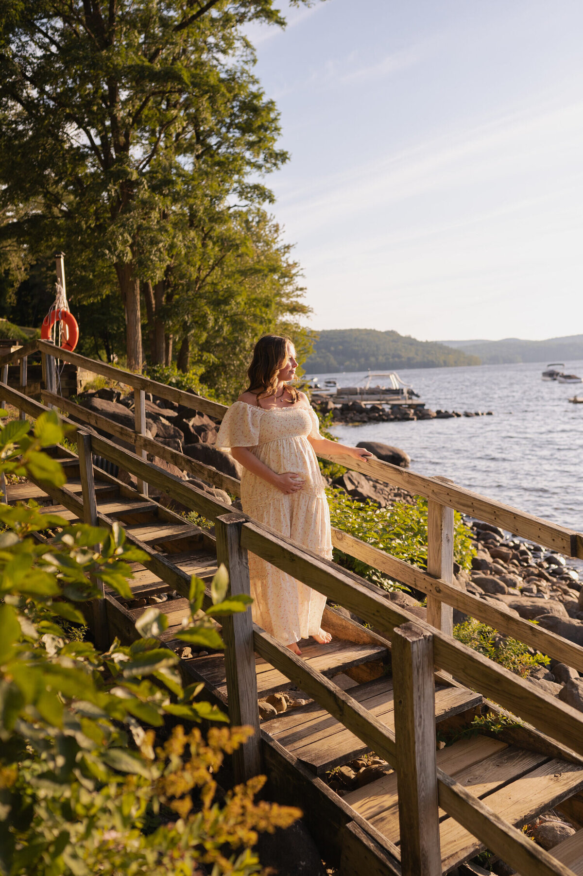 Overlooking the shores of Sacandaga Lake for maternity photos near Lake Pleasant, NY.