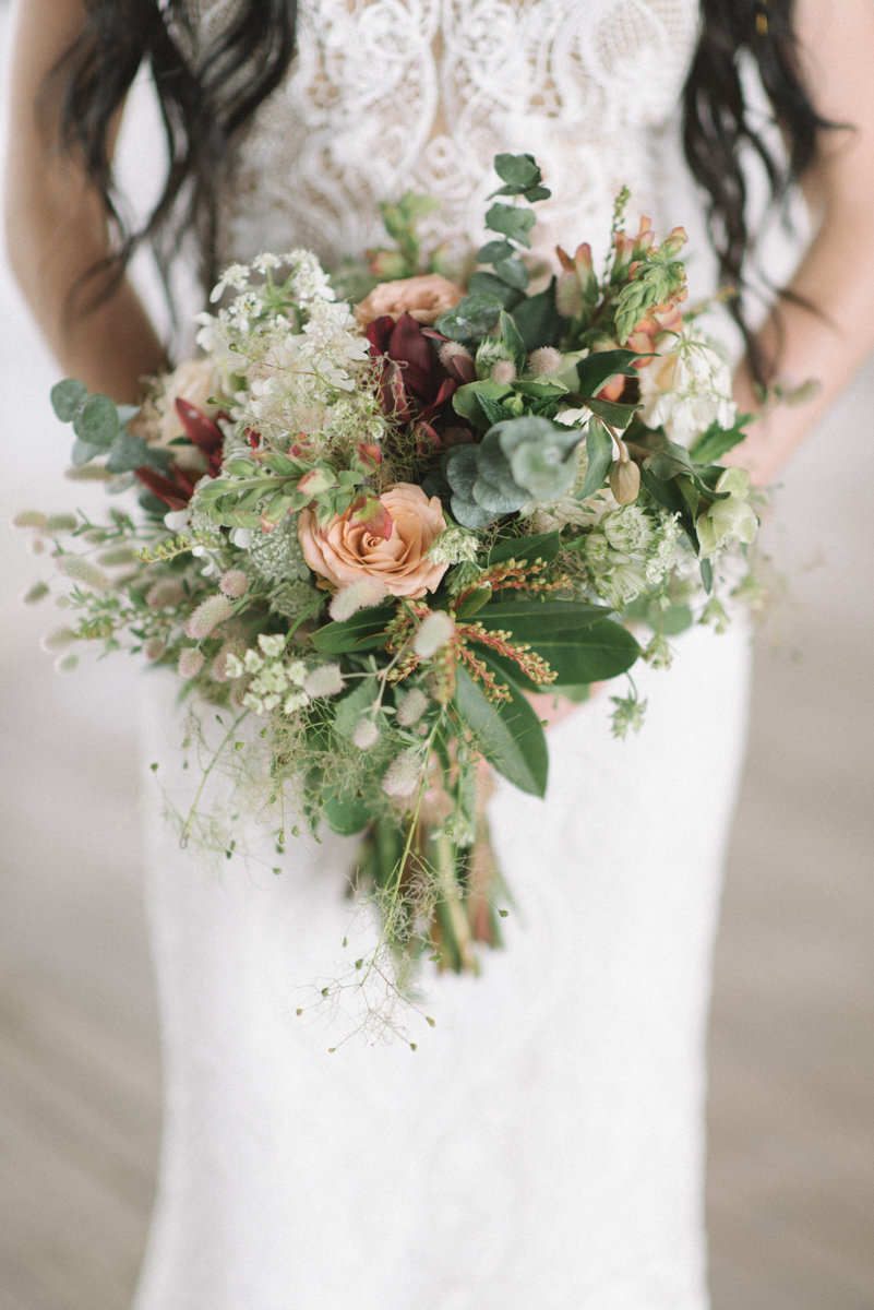 Lovely bride wedding dress and boho flowers