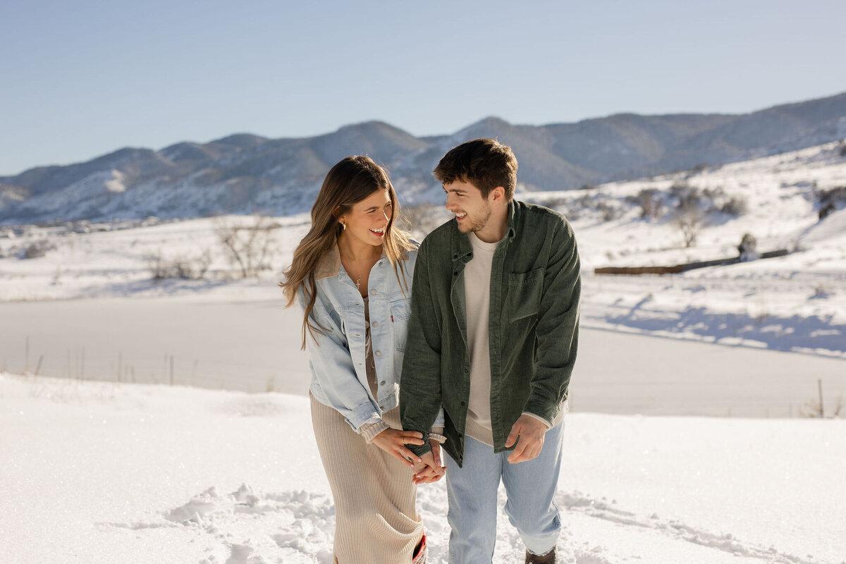 couple looking at each other on their winter vacation in Colorado