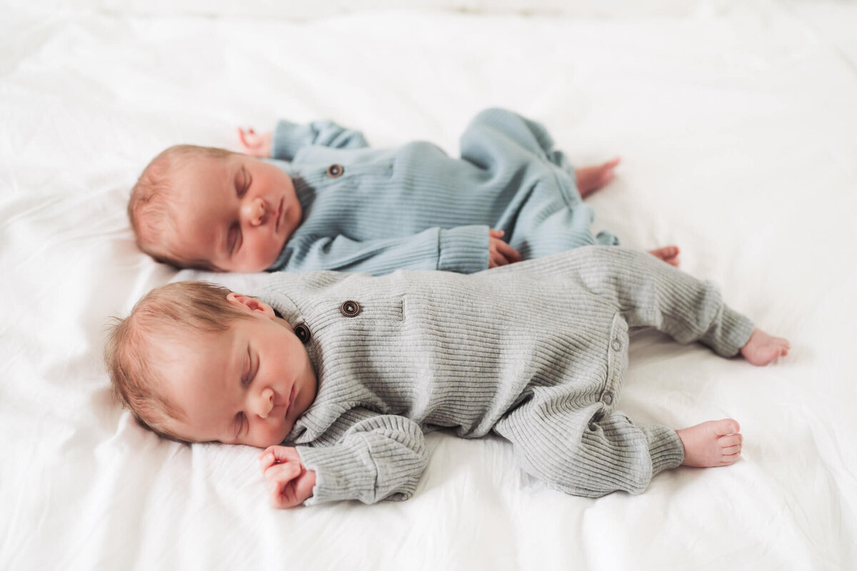 Twin newborns posing for newborn photos