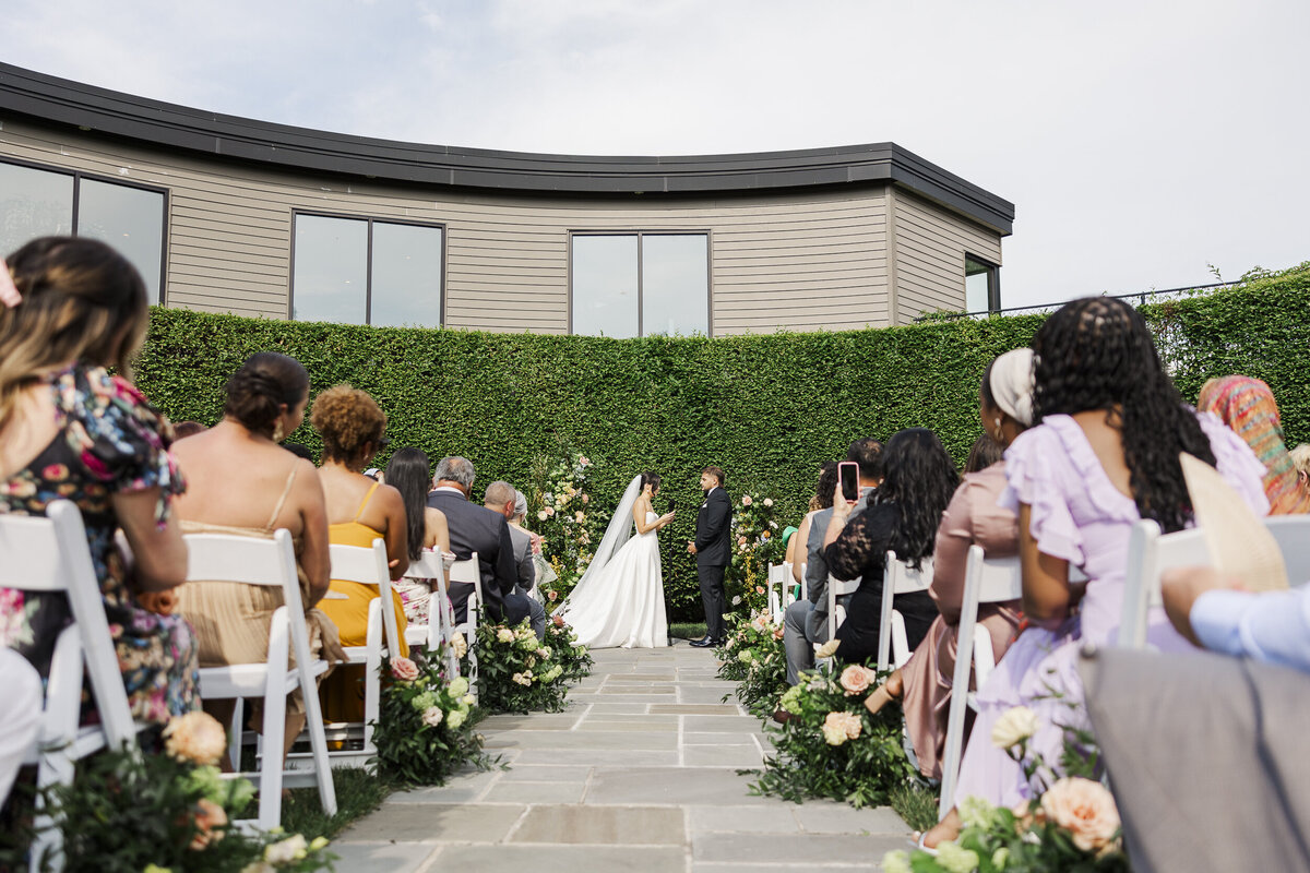 Couple gets married outdoors at The Roundhouse in front of their greenery