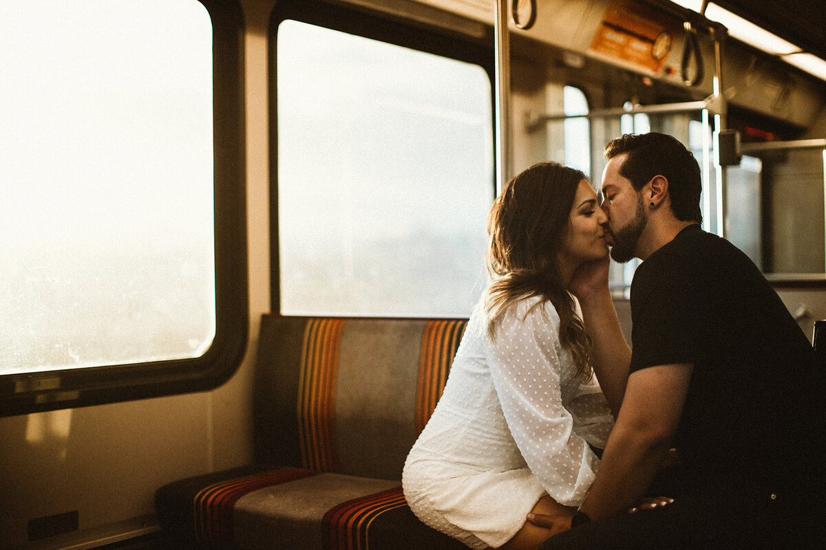 bride and groom kiss on Union Station train in Colorado