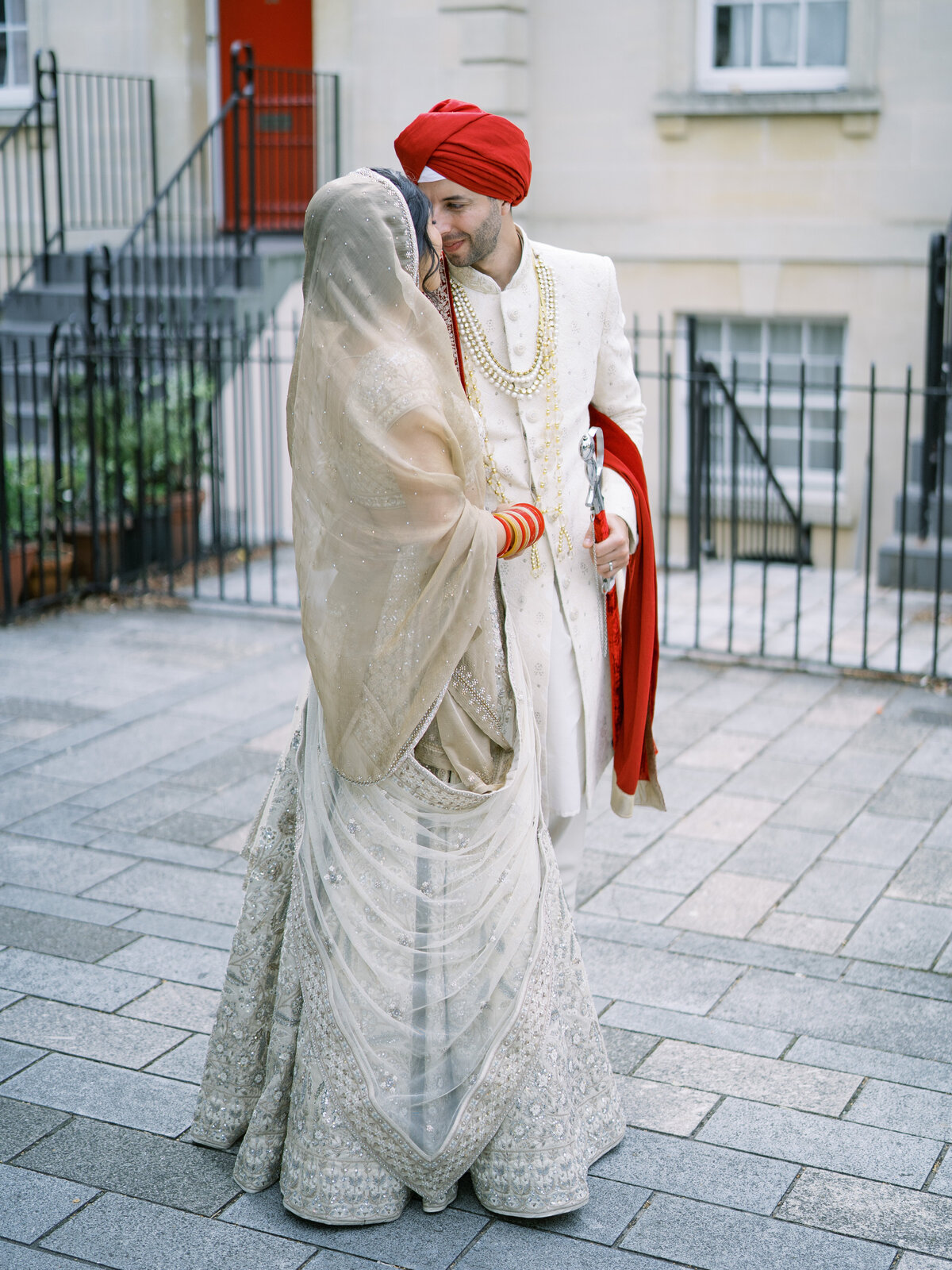 Bride and groom in traditional dress at Sikh wedding