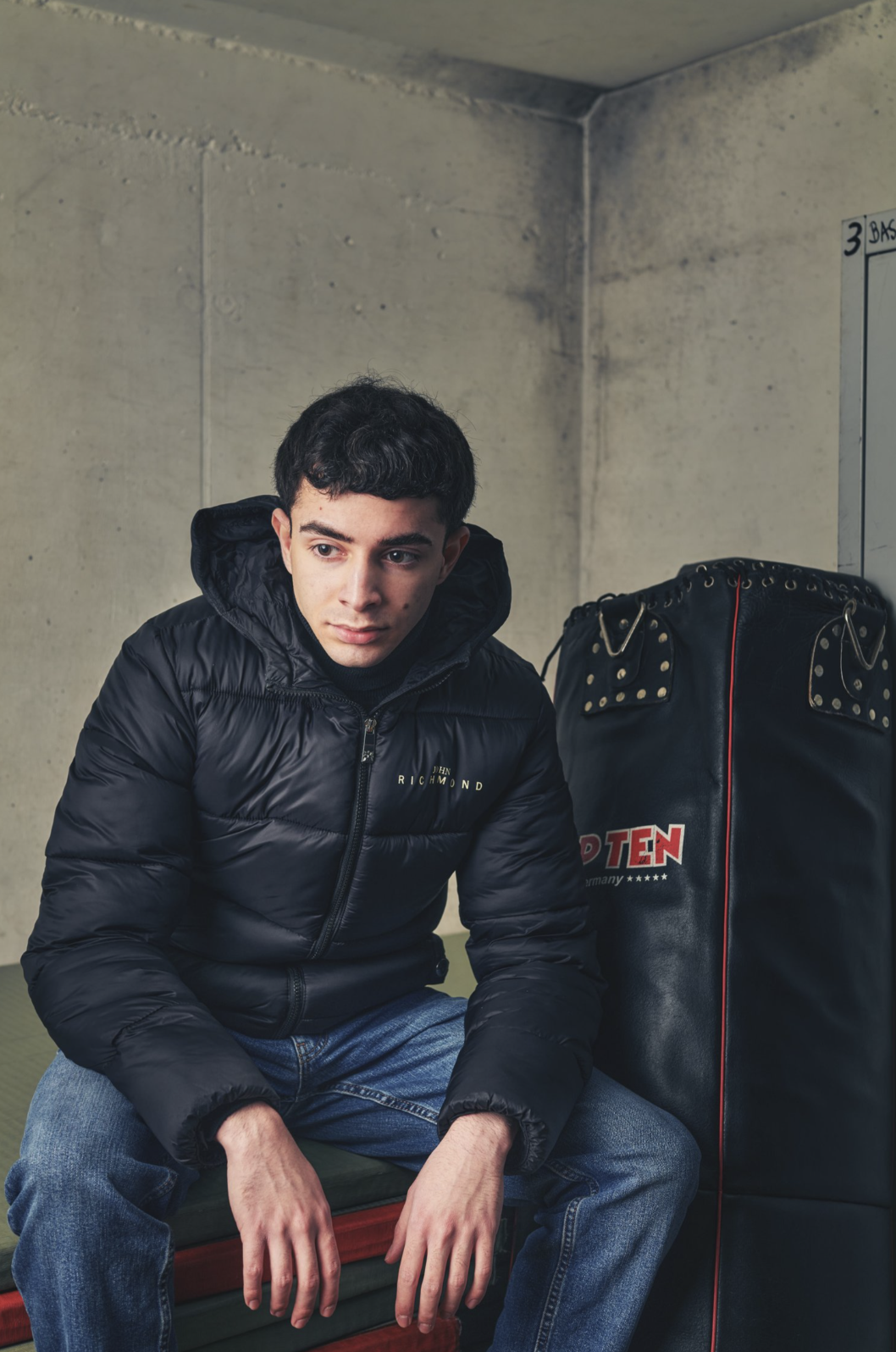 A framed portrait with symbolic elements suggesting story.