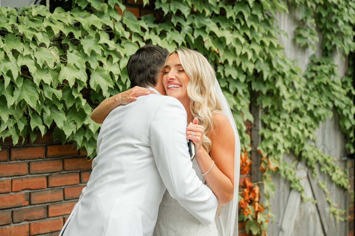 Couple hugging in their wedding photo