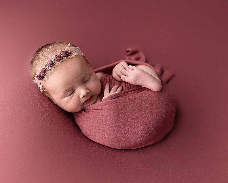 baby in mauve