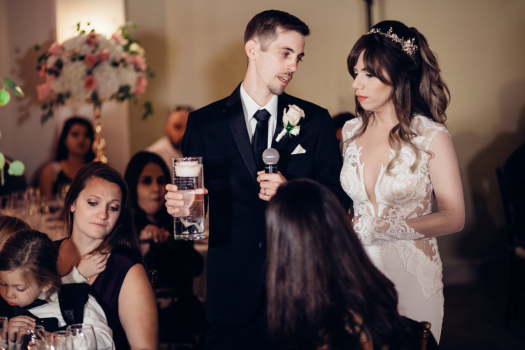 Wedding Photograph Of Groom Staring At His Bride While Speaking Los Angeles