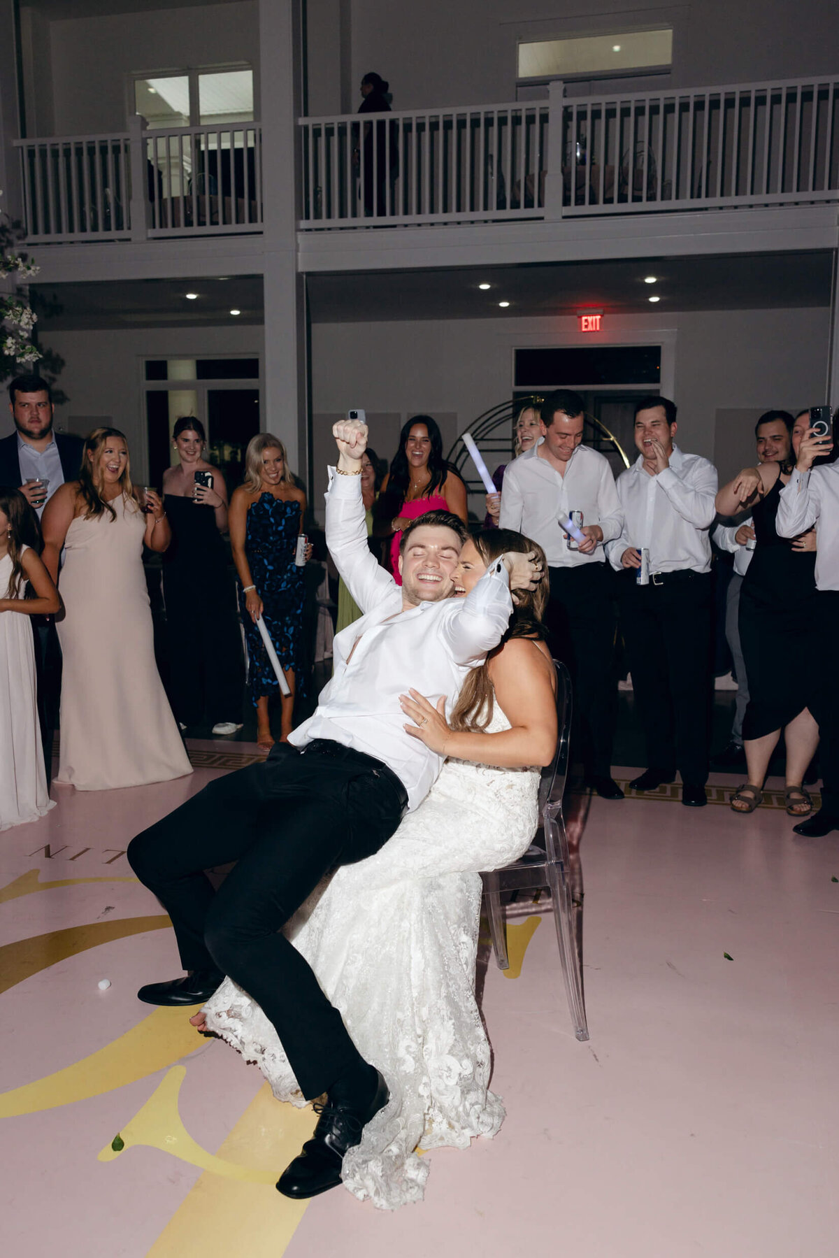 A wedding photo of the bride and groom dancing during the wedding reception